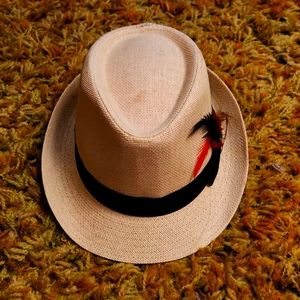 D&Y Ladies cream colored fedora with black band and feather